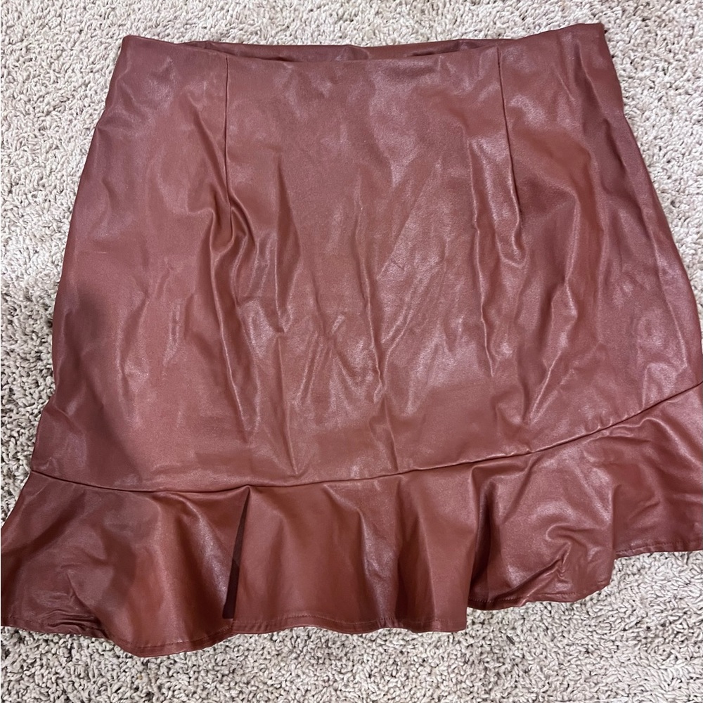 cute pleather skirt L. No stretch. Cute with boots!!